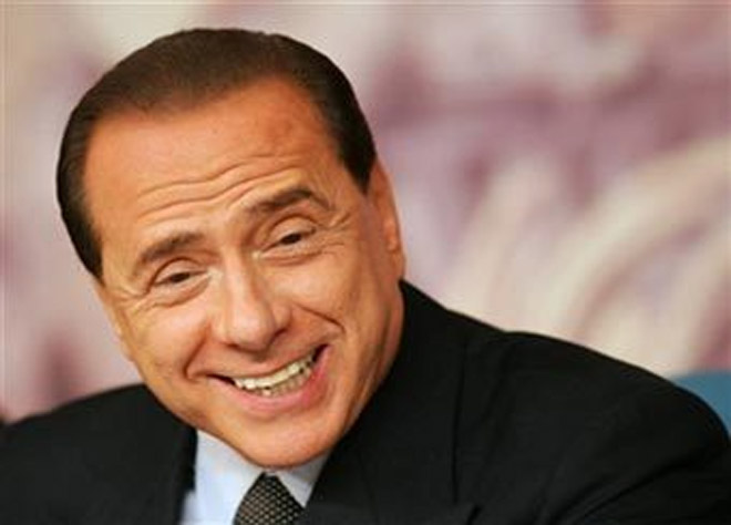 Berlusconi backs Deneuve on male courtship
