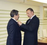President Ilham Aliyev hands out Dostlug order and Taraggi medal to public figures (PHOTO)