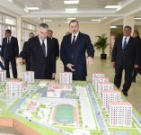 President Ilham Aliyev reviews newly-built residential complex for IDP families in Mingachevir