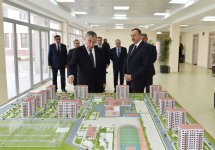 President Ilham Aliyev reviews newly-built residential complex for IDP families in Mingachevir