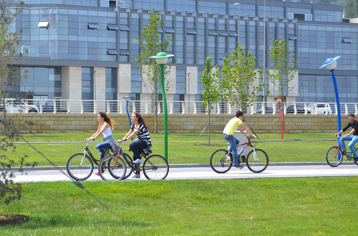 Youth pushing pedals on Baku Boulevard on eve of European Games
