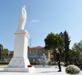Ilham Aliyev visits a statue of national leader Heydar Aliyev in Goychay
