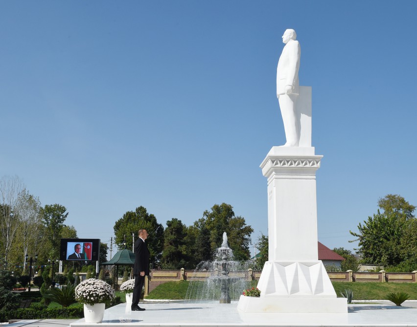 Ilham Aliyev visits a statue of national leader Heydar Aliyev in Goychay