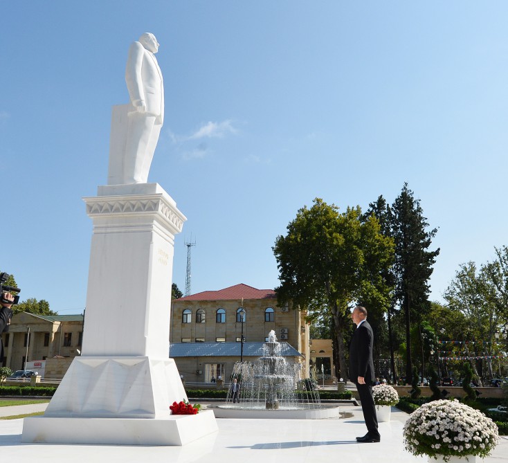 Ilham Aliyev visits a statue of national leader Heydar Aliyev in Goychay
