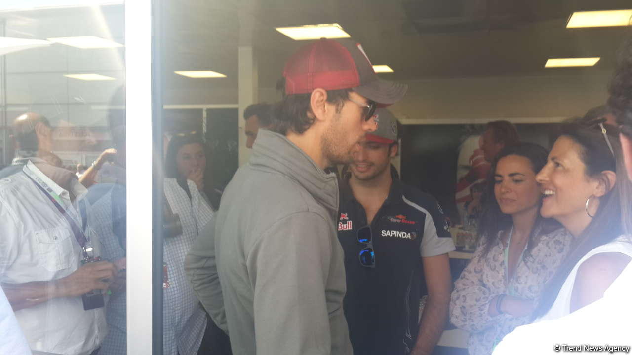 Enrique Iglesias visits pit boxes of teams participating in F1 Grand Prix of Europe in Baku