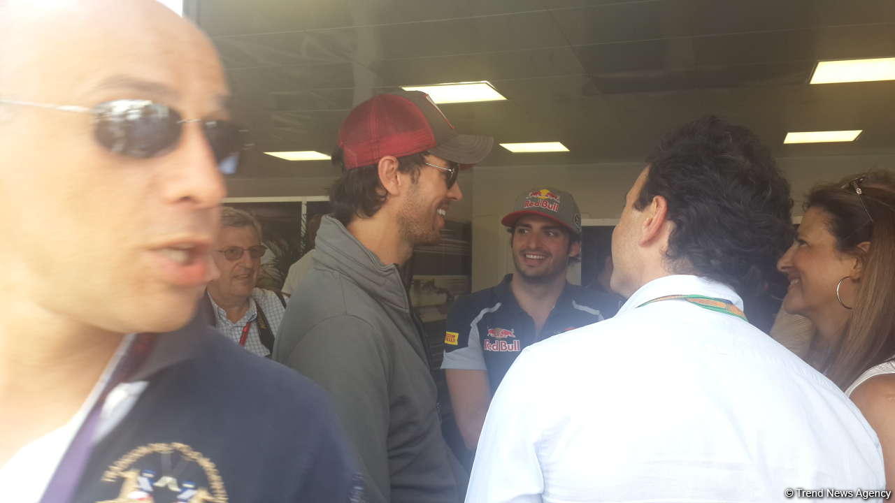 Enrique Iglesias visits pit boxes of teams participating in F1 Grand Prix of Europe in Baku