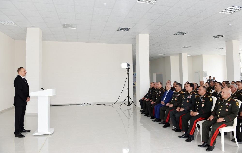 President Aliyev views residential building for servicemen