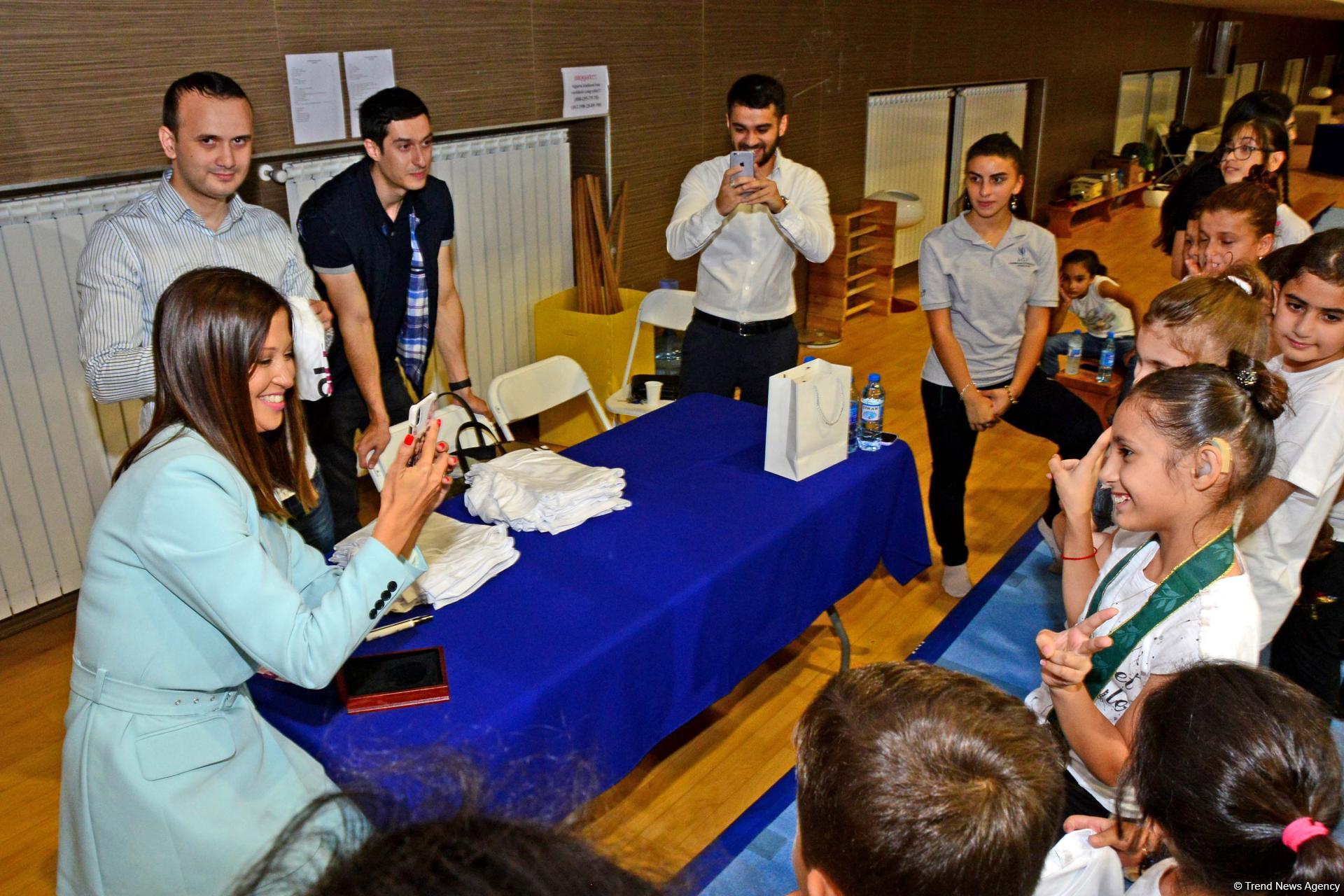 World champion gymnast meets children with disabilities in Baku (PHOTO)