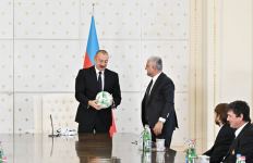 Uniform of Qarabag football club and ball with autographs of players presented to President Ilham Aliyev (PHOTO)