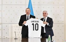 Uniform of Qarabag football club and ball with autographs of players presented to President Ilham Aliyev (PHOTO)
