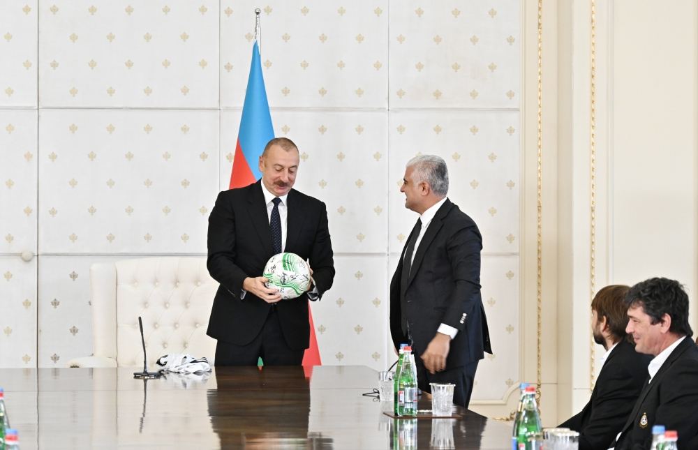 Uniform of Qarabag football club and ball with autographs of players presented to President Ilham Aliyev (PHOTO)