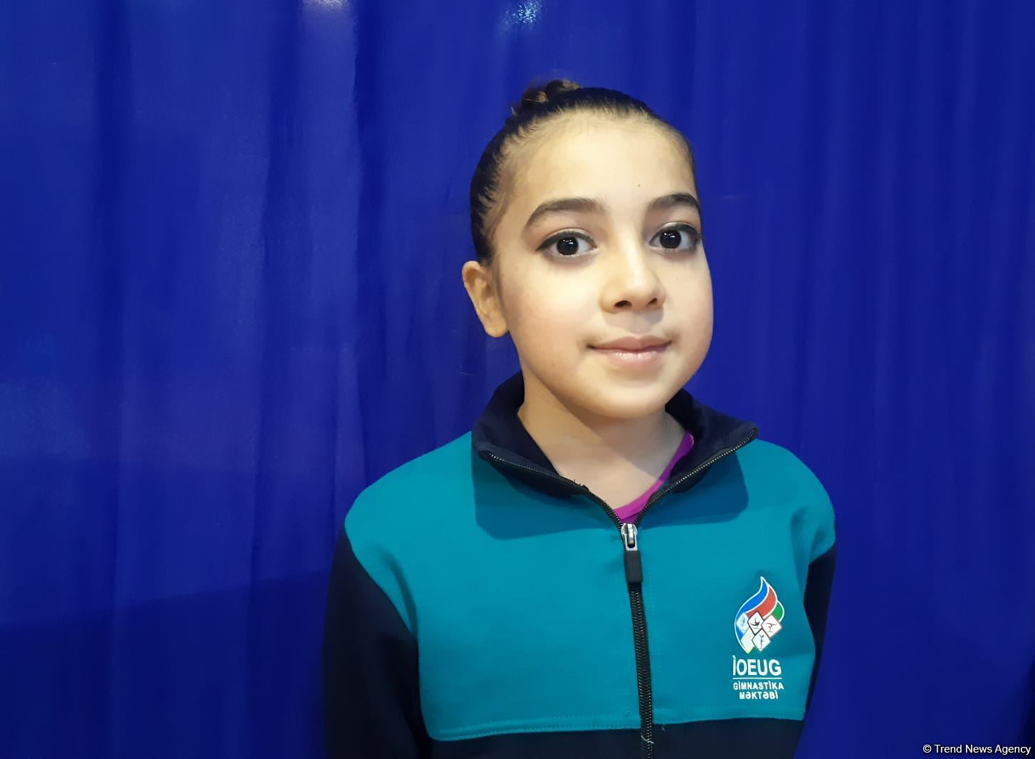 Participant of trampoline championship tries to improve her results at every training session