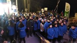 Participants of rally watch address of President Ilham Aliyev to people of Azerbaijan (PHOTO)