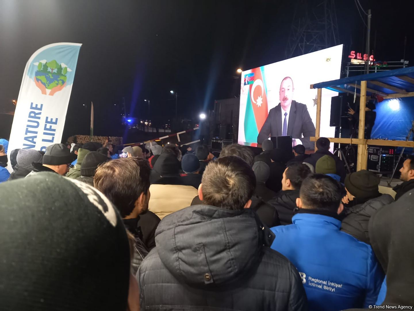 Participants of rally watch address of President Ilham Aliyev to people of Azerbaijan (PHOTO)
