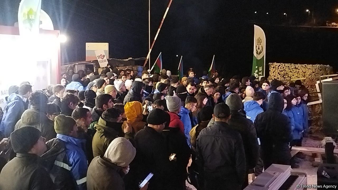 Participants of rally watch address of President Ilham Aliyev to people of Azerbaijan (PHOTO)