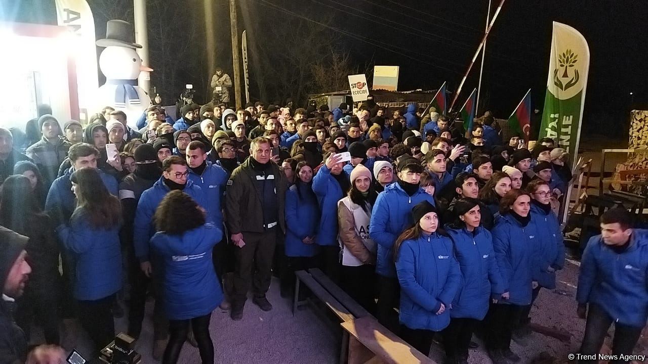 Participants of rally watch address of President Ilham Aliyev to people of Azerbaijan (PHOTO)