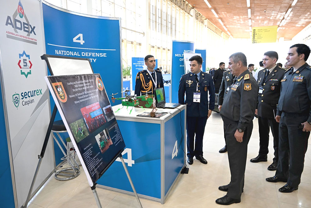Azerbaijani minister views National Defense University booth
