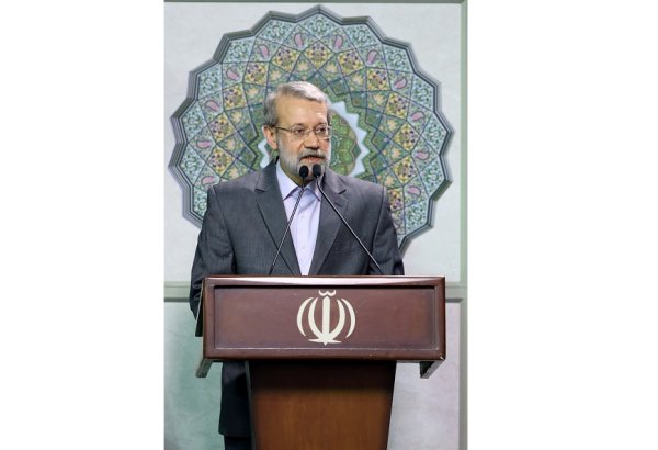 Iran warns against pressure on its nuclear program that risks triggering dev't of atomic bomb