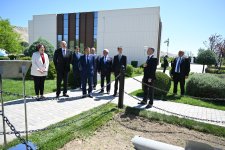 President Ilham Aliyev, int'l guests visit area of plant targeted by Armenian missile attack during Patriotic War (PHOTO)