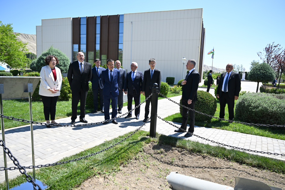 President Ilham Aliyev, int'l guests visit area of plant targeted by Armenian missile attack during Patriotic War (PHOTO)