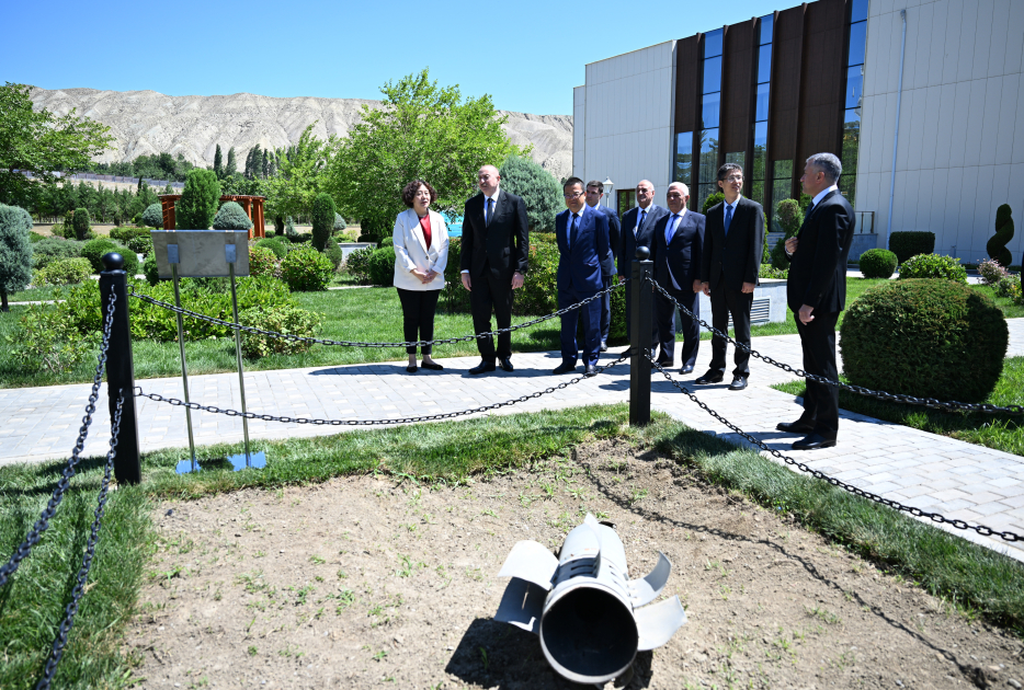 President Ilham Aliyev, int'l guests visit area of plant targeted by Armenian missile attack during Patriotic War (PHOTO)