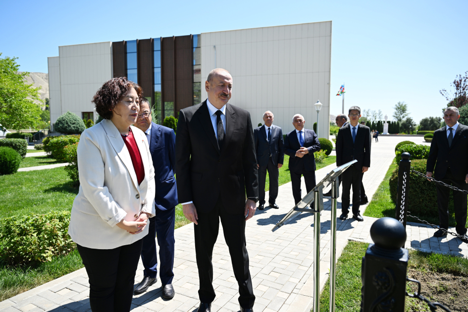 President Ilham Aliyev, int'l guests visit area of plant targeted by Armenian missile attack during Patriotic War (PHOTO)